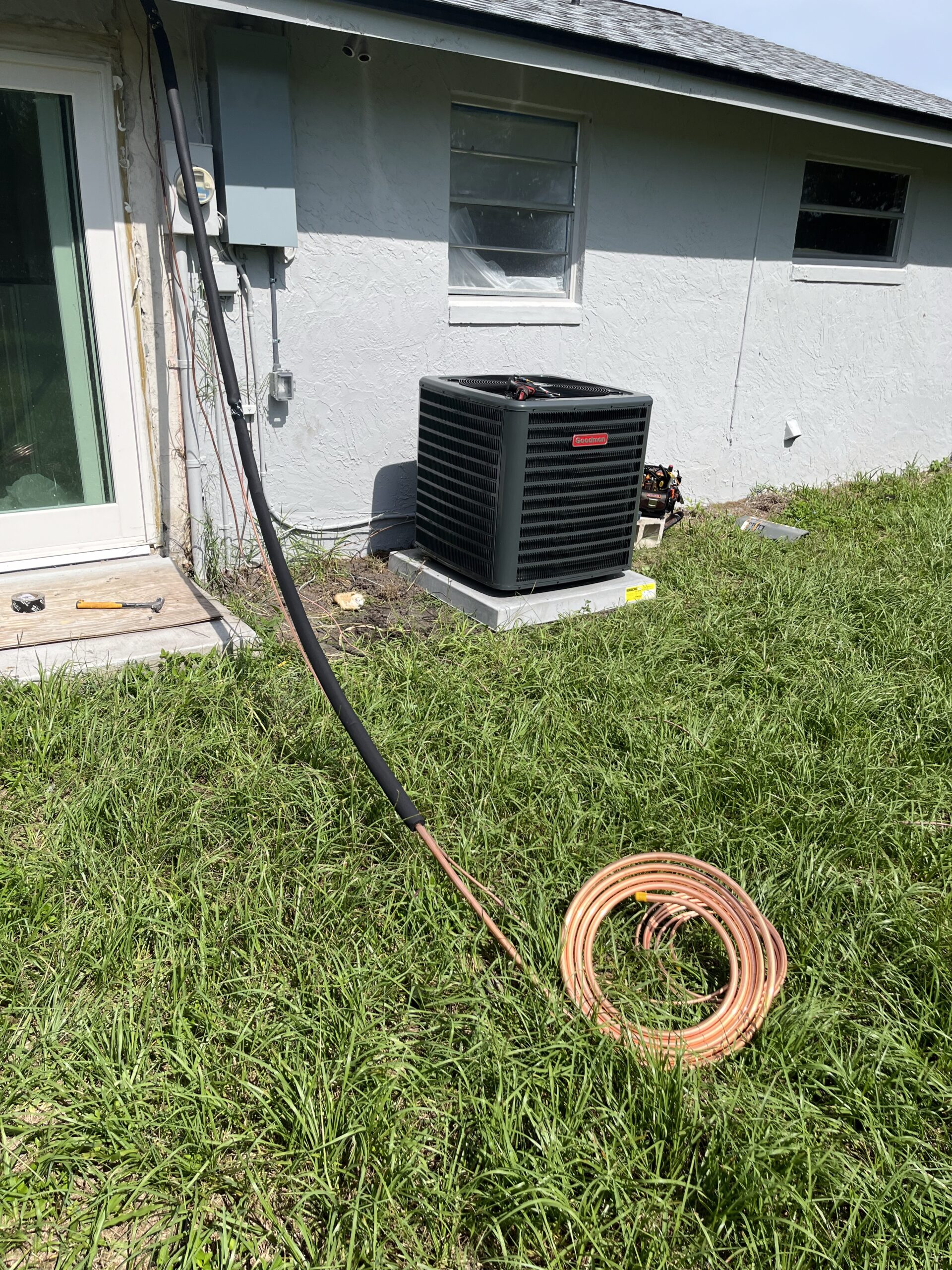 HVAC technician performing preventive AC maintenance to avoid expensive air conditioner repairs