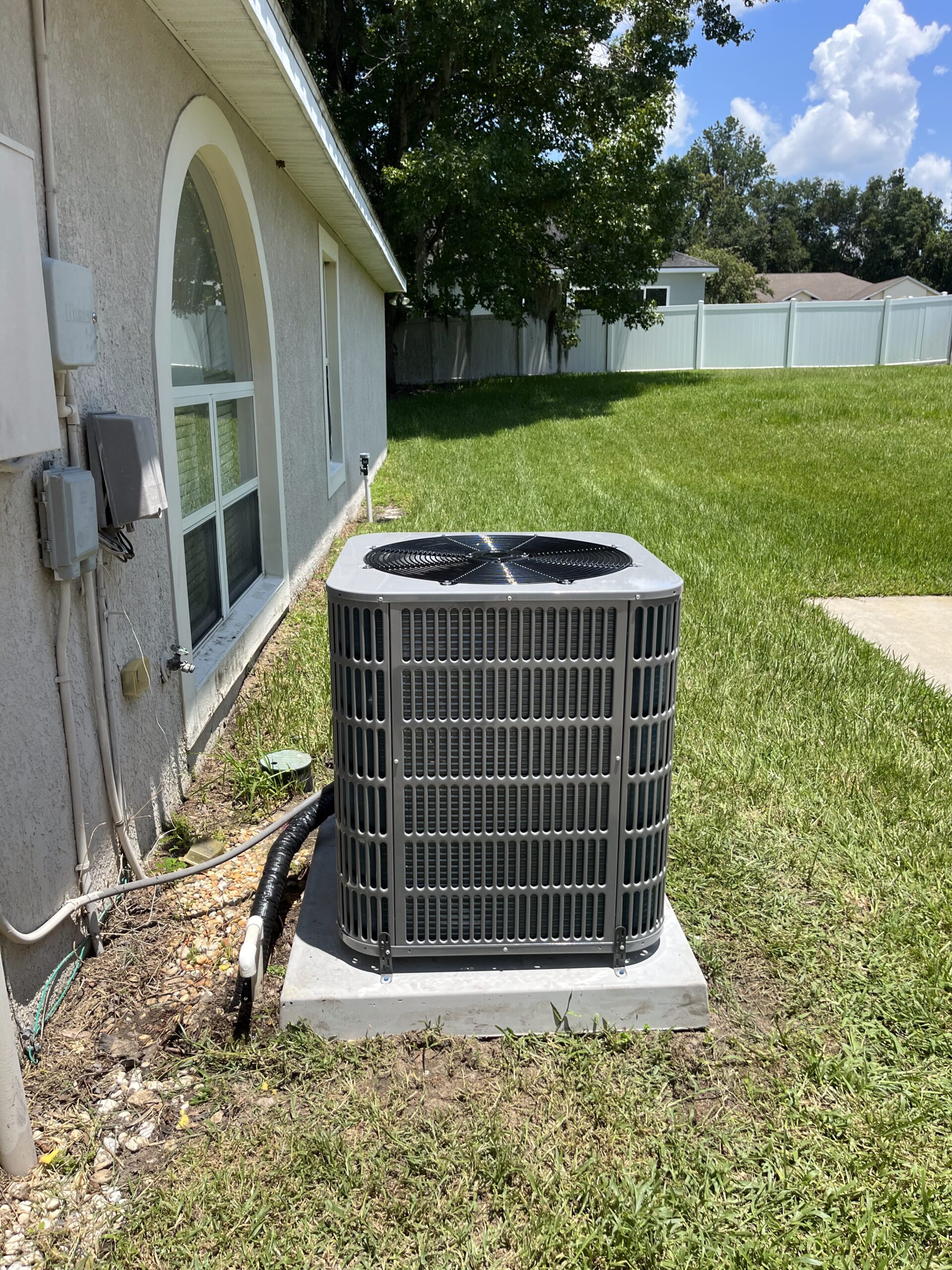 Technician providing the best air conditioner installation service in a residential home