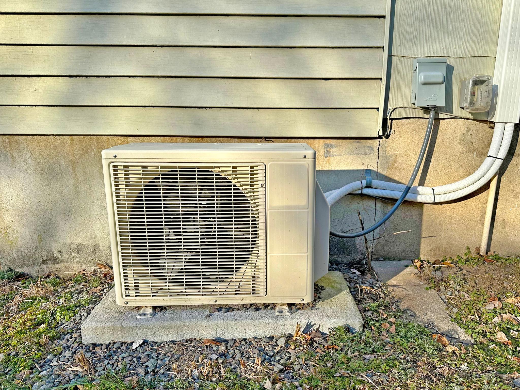 Homeowner enjoying comfortable indoor temperatures with a ductless mini-split system