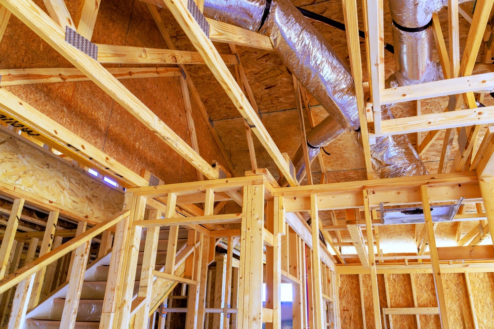 HVAC technician performing proper ductwork installation to improve indoor air quality